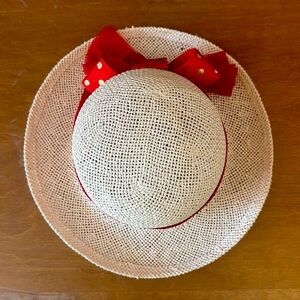 Cute straw like hat with red and gold dot band.